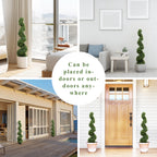 pair of 43 inch faux boxwood spiral trees flanking front entrance door creating classic formal evergreen welcome