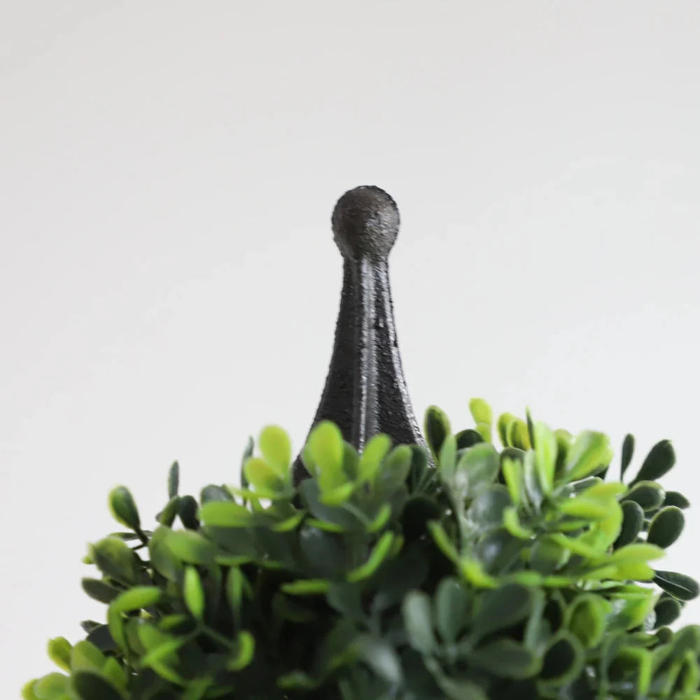 detailed view of artificial dark green boxwood leaves showing rich evergreen color and small round glossy texture