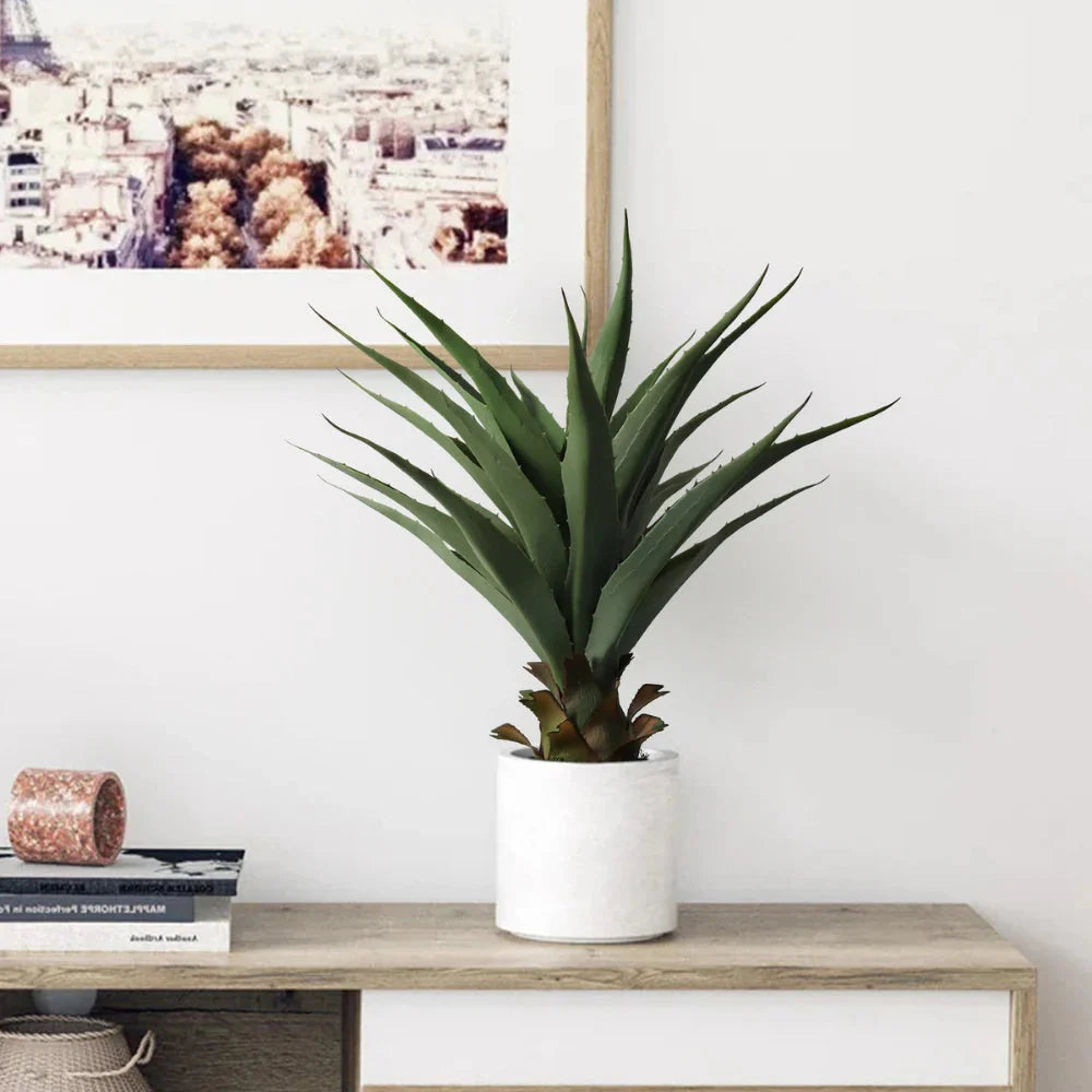 close up of faux sansevieria leaf on 27 inch plant showing thick succulent texture, dark green color, and thin yellow edge