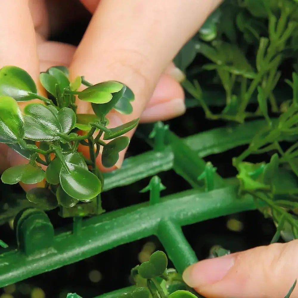 detailed view of artificial boxwood leaves on triple ball tree showing small round glossy green foliage