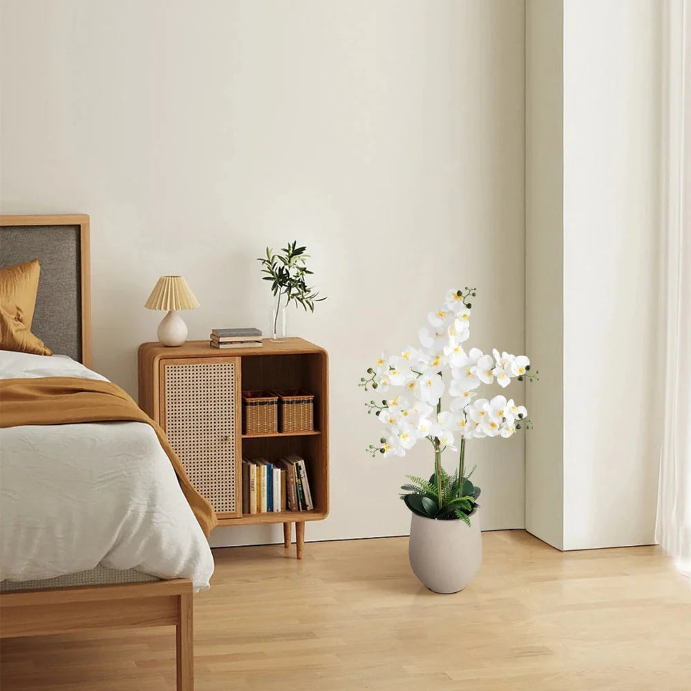 artificial phalaenopsis orchid on office reception desk or side table adding elegant professional greenery without maintenance