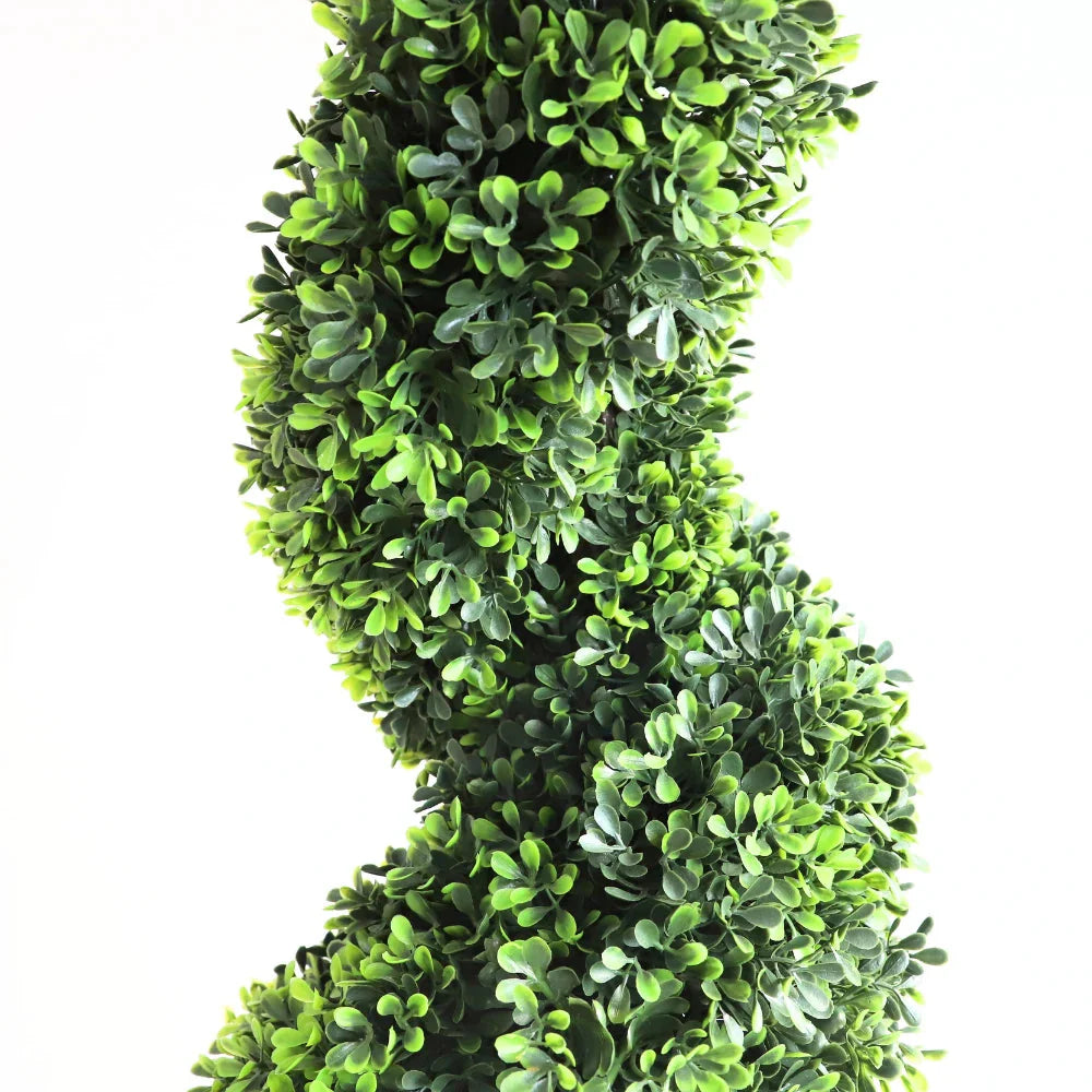 detailed view of artificial boxwood leaves on elegant spiral tree showing classic green color and small glossy texture