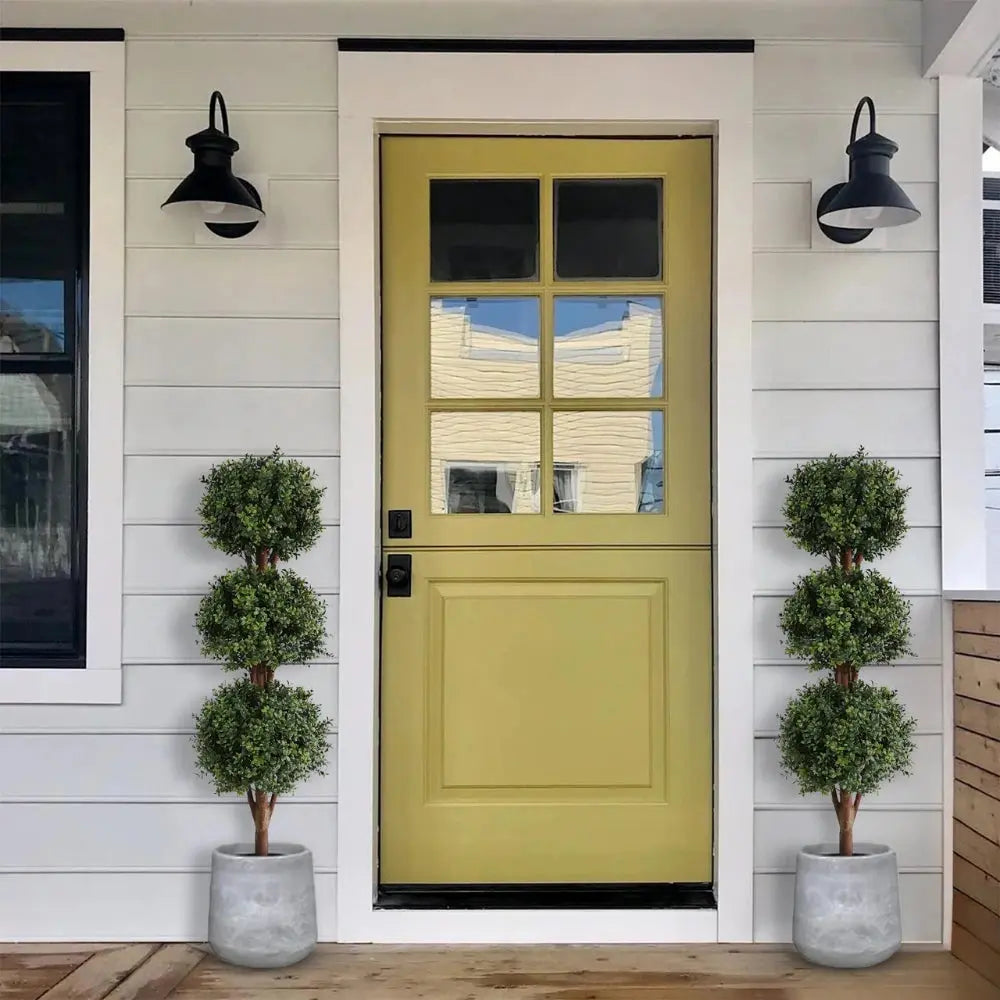 set of 2 faux 3 tier boxwood trees on covered porch steps for traditional southern style entry