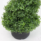 set of 2 artificial spiral topiary trees on covered porch steps for traditional southern or colonial style entry
