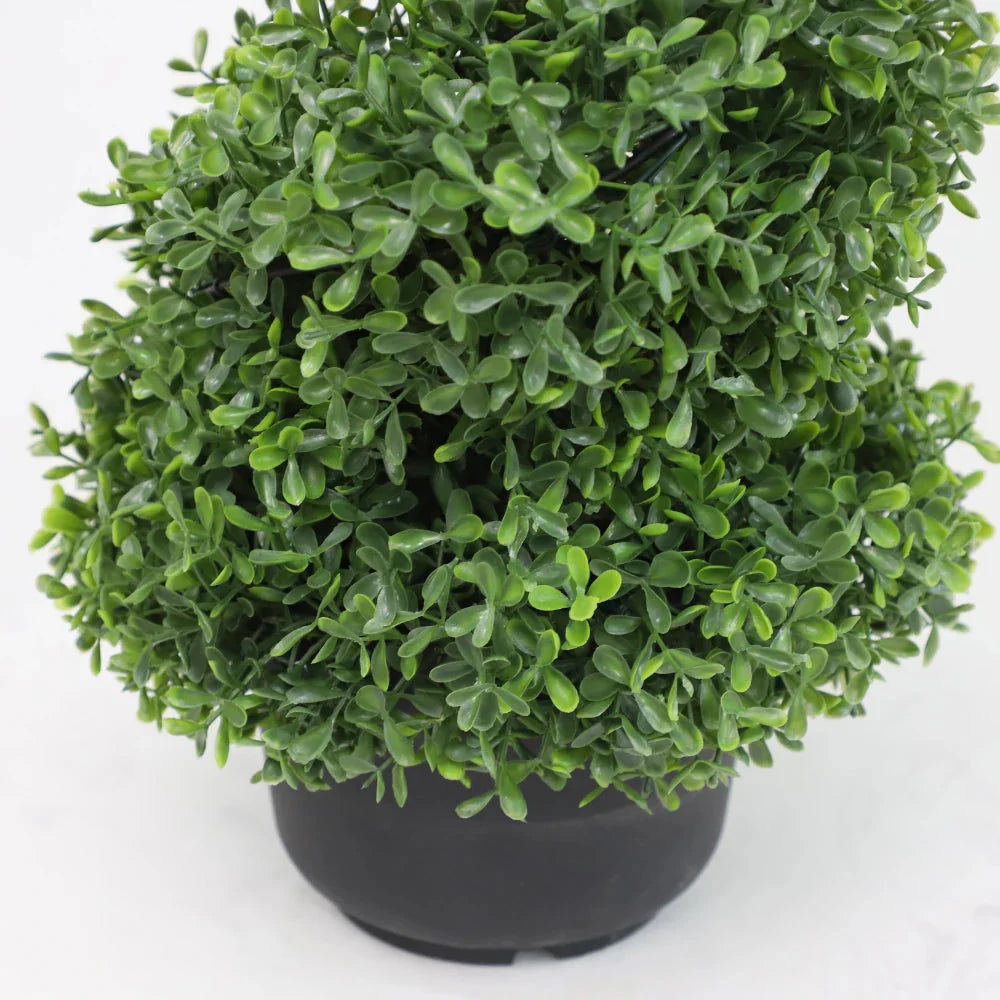 set of 2 artificial spiral topiary trees on covered porch steps for traditional southern or colonial style entry