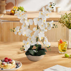 24 inch faux phalaenopsis orchid on bedroom nightstand for calm spa like atmosphere in master bedroom