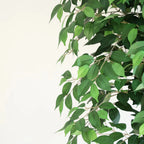 pair of 70 inch faux topiary ficus trees flanking large double front entrance doors creating grand formal welcome