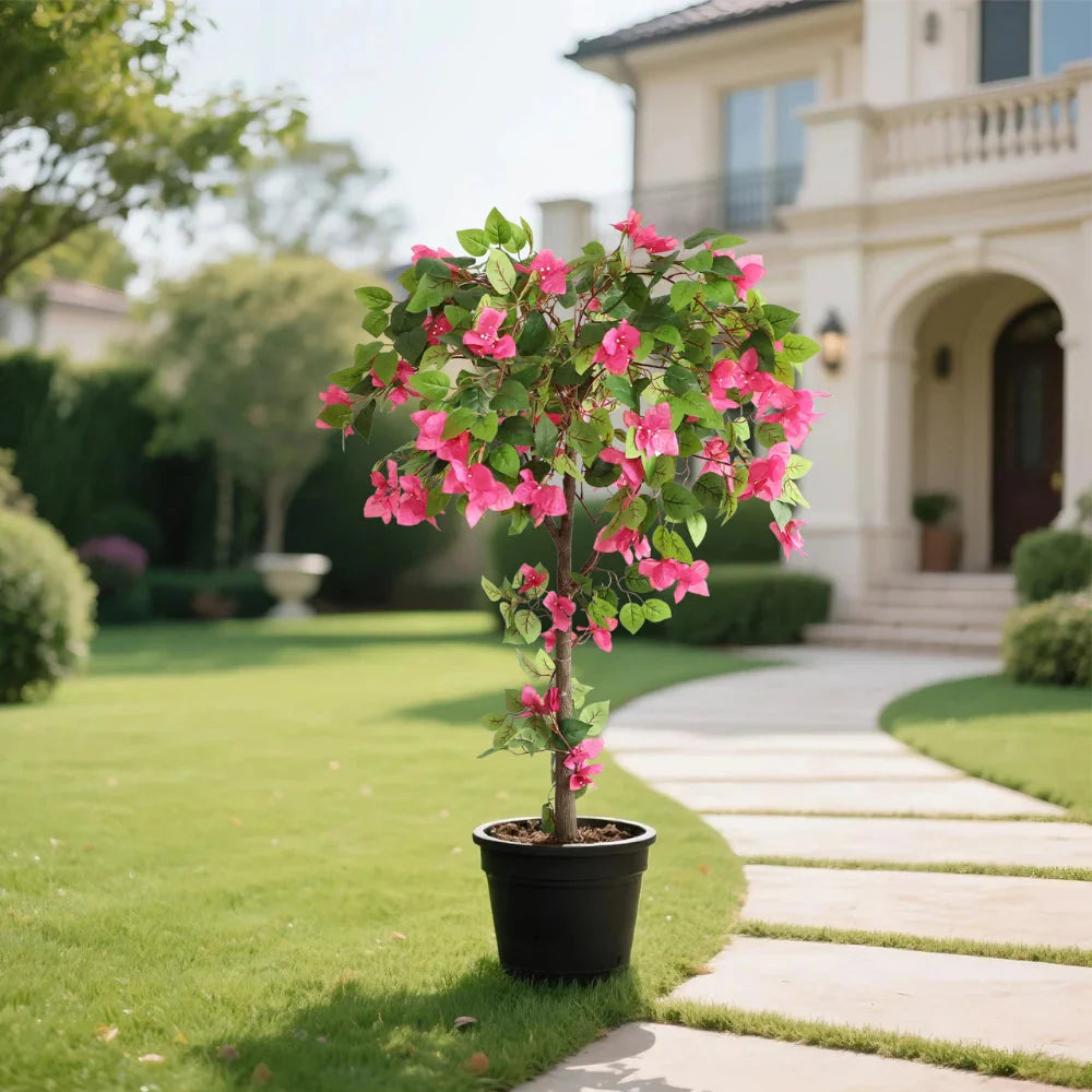 artificial bougainvillea tree on covered patio next to outdoor seating creating tropical resort atmosphere at home
