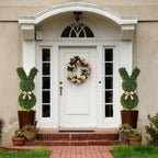 pair of 36 inch easter bunny topiaries flanking front entrance door creating festive spring welcome for holiday