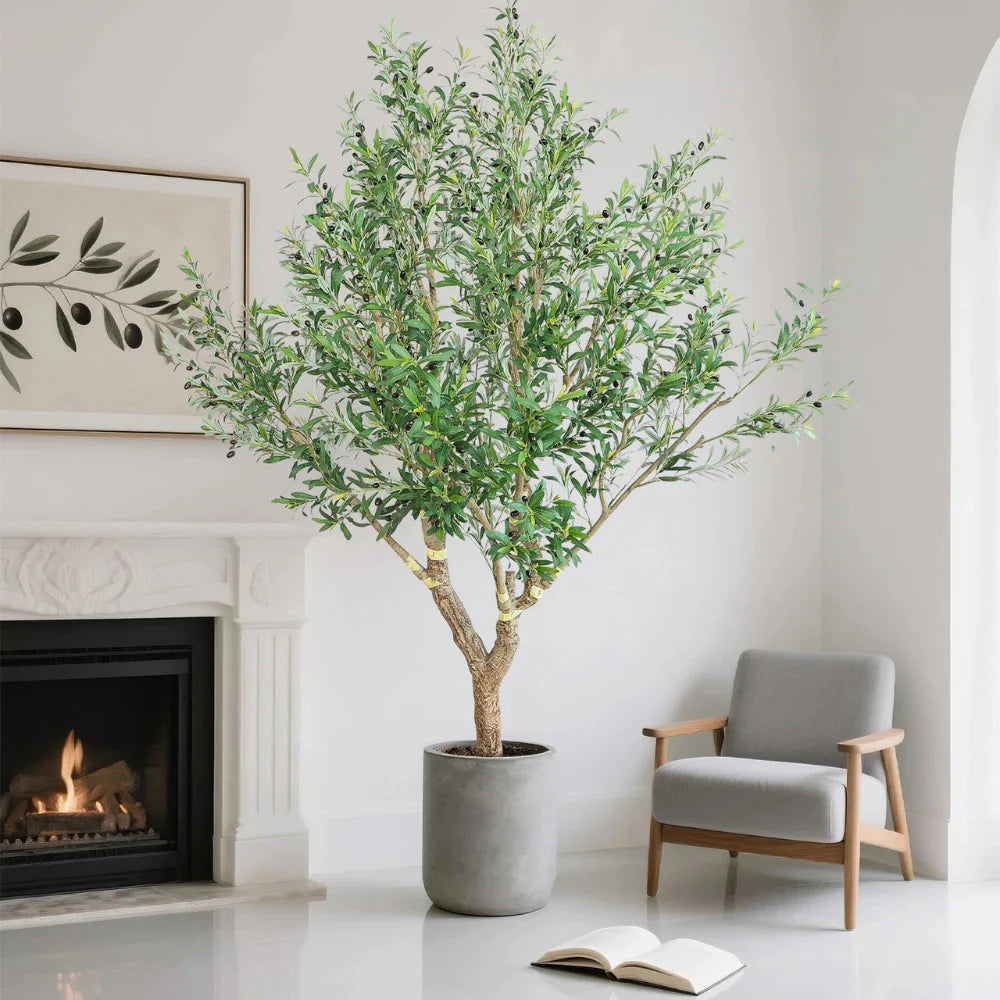 8.2 foot giant faux olive tree next to two story window demonstrating height for atrium and vaulted ceiling spaces