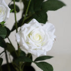 close up of artificial white rose with layered petals, cream center, and subtle gradient from pure white to ivory
