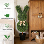 single 36 inch faux easter bunny topiary with wireframe rabbit shape covered in green boxwood style leaves and red bow