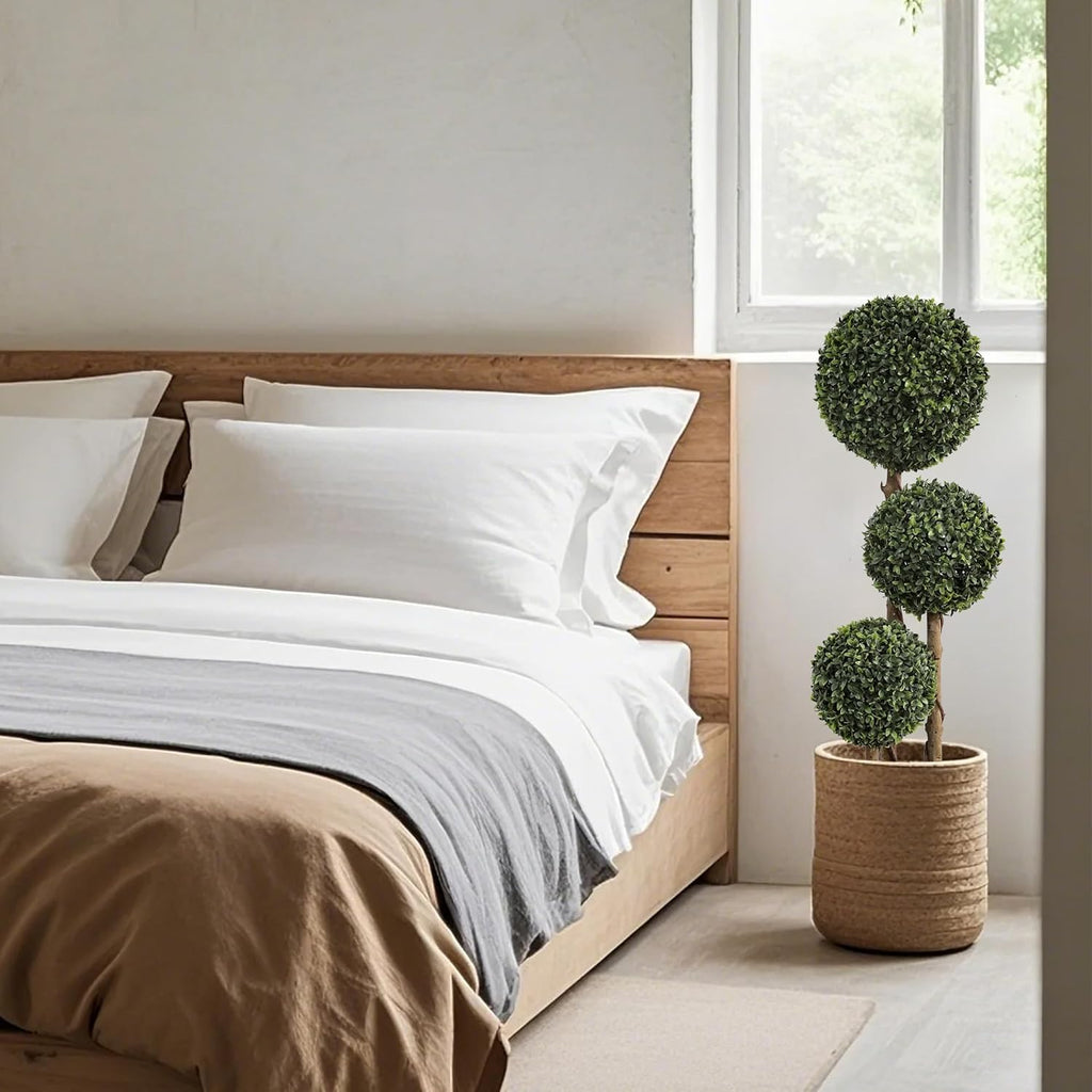 pair of triple ball topiaries flanking front door