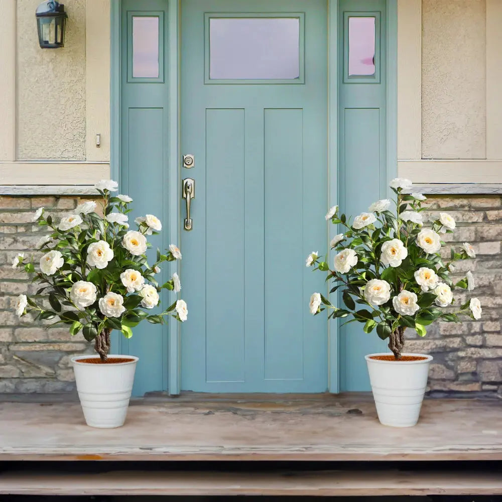 single 36 inch faux white camellia spike tree with layered white flowers and glossy green leaves on narrow trunk