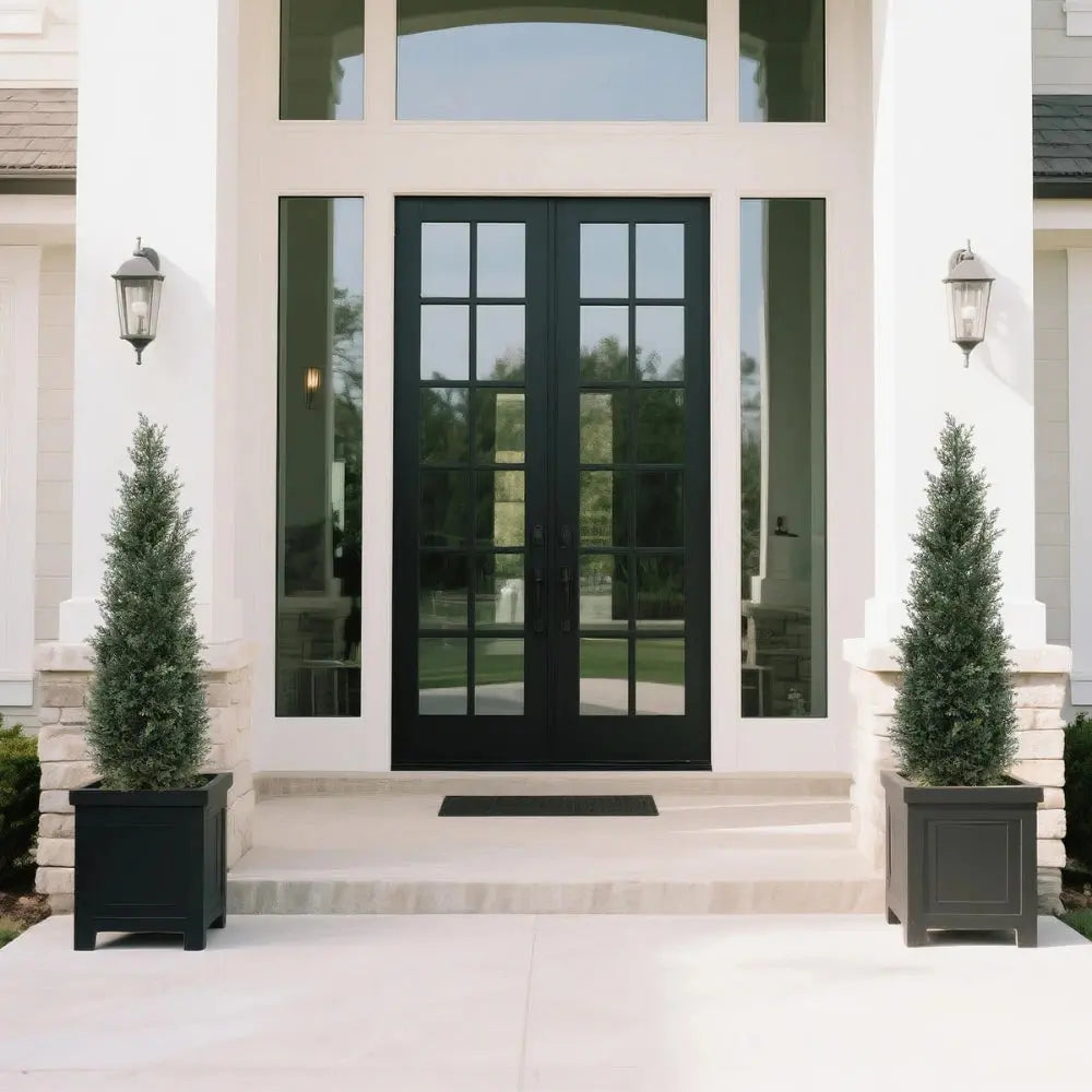 set of 2 artificial topiary cedar trees on covered porch steps for traditional southern or colonial style entry