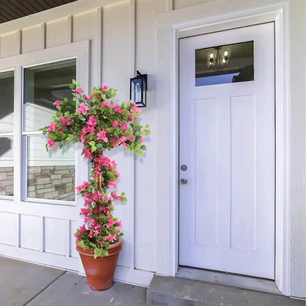 tall faux flowering tree at grand front entrance door or double door entry for dramatic tropical welcome