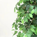 pair of 63 inch faux topiary ficus trees flanking front entrance door on covered porch creating formal symmetrical welcome