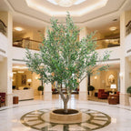 detailed view of silvery-green olive leaves on 8.2 foot faux tree with matte finish and natural vein patterns