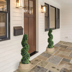 pair of 43 inch dark green faux boxwood spiral trees flanking front entrance door for classic formal welcome