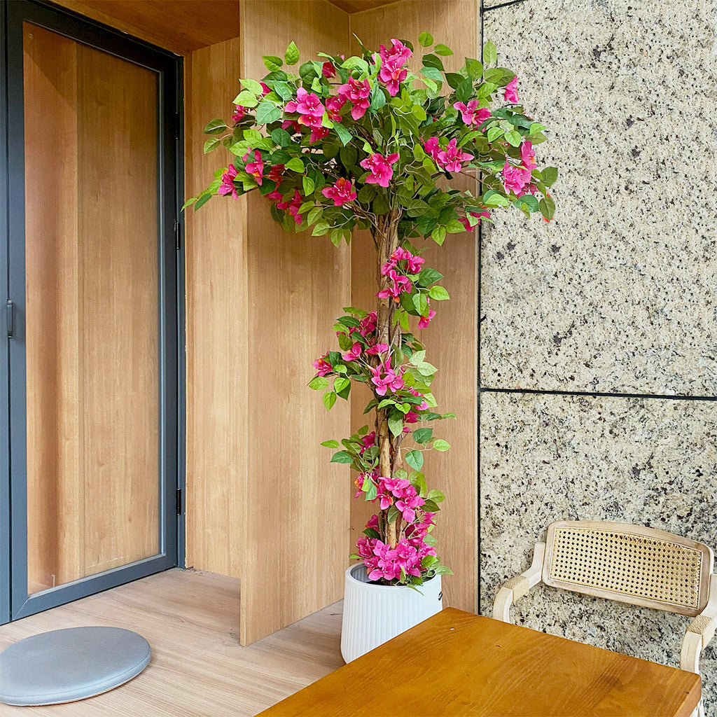 tall faux flowering tree at grand front entrance door or double door entry for dramatic tropical welcome