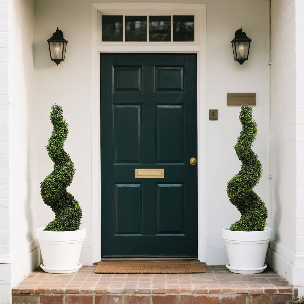 pair of 110cm milan spiral trees flanking front entrance door for elegant Italian inspired welcome